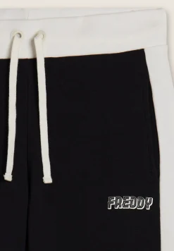 Freddy Pantaloni neri con bande laterali bianche-Donna Pantaloni Sportivi